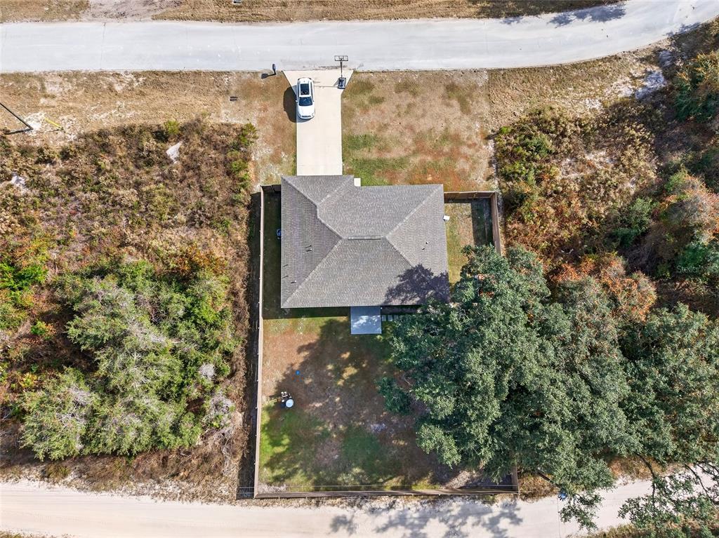 14862 Southwest 79 Terrace Road Dunnellon, FL 34432 - Photo 27 of 28 a view of a pathway both side of building