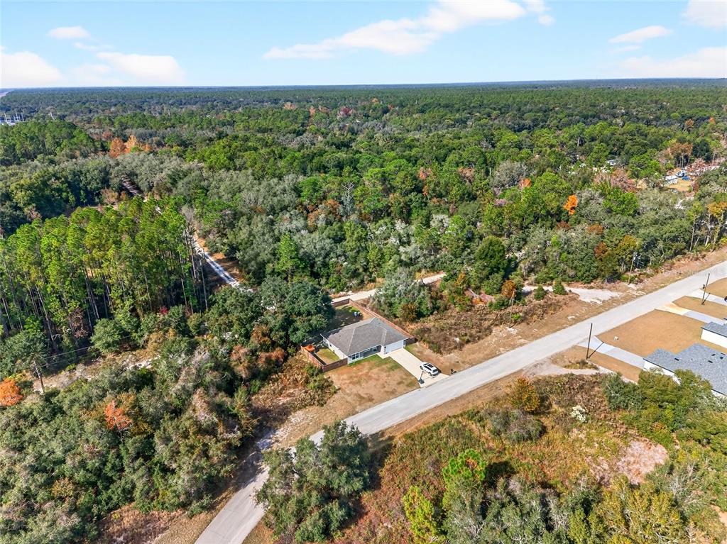 14862 Southwest 79 Terrace Road Dunnellon, FL 34432 - Photo 28 of 28 an aerial view of a house with a yard and lake view