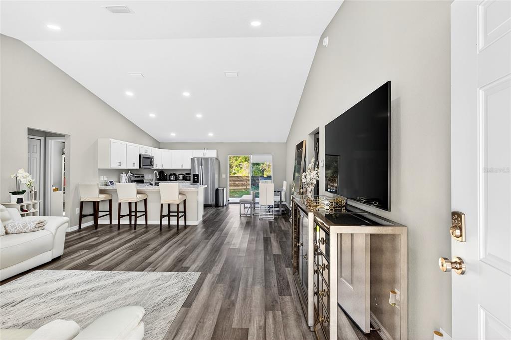 14862 Southwest 79 Terrace Road Dunnellon, FL 34432 - Photo 3 of 28 a living room with furniture and a flat screen tv