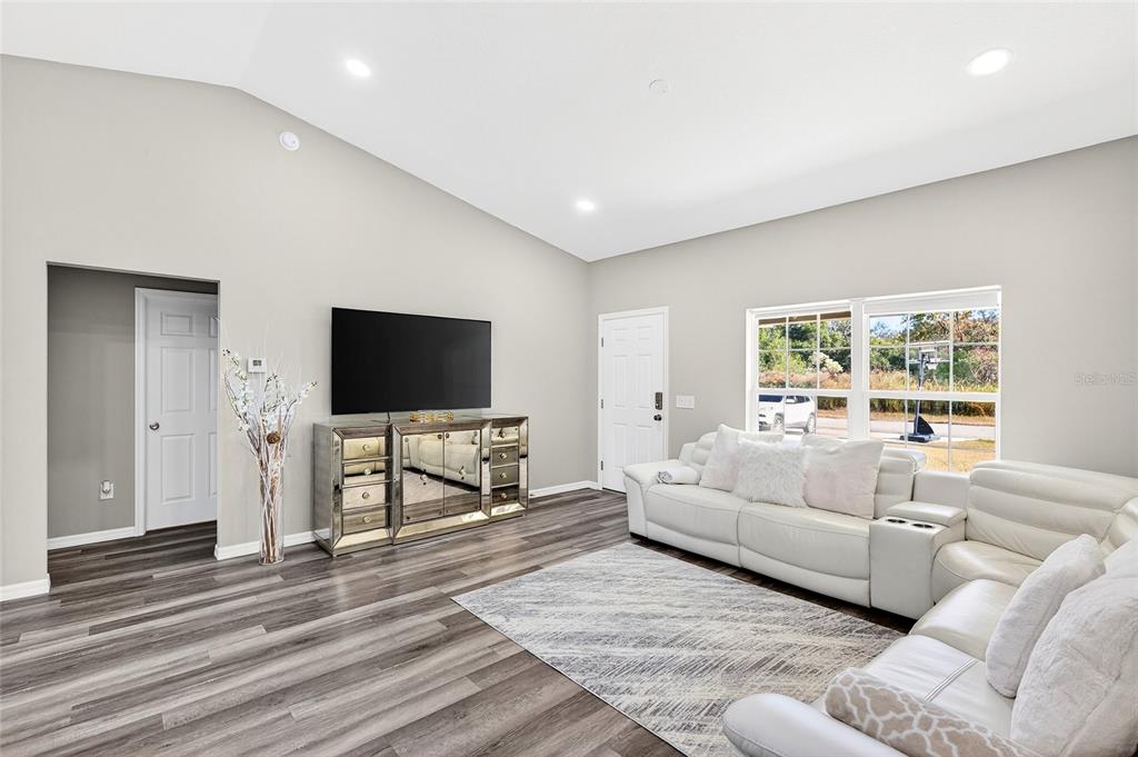 14862 Southwest 79 Terrace Road Dunnellon, FL 34432 - Photo 5 of 28 a living room with furniture and a flat screen tv