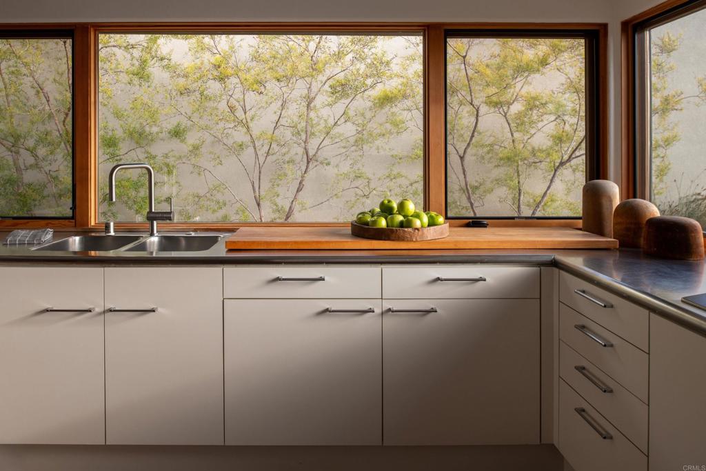 14014 Rue D Antibes Del Mar, CA 92014 - Photo 17 of 46 a kitchen with a sink and large window
