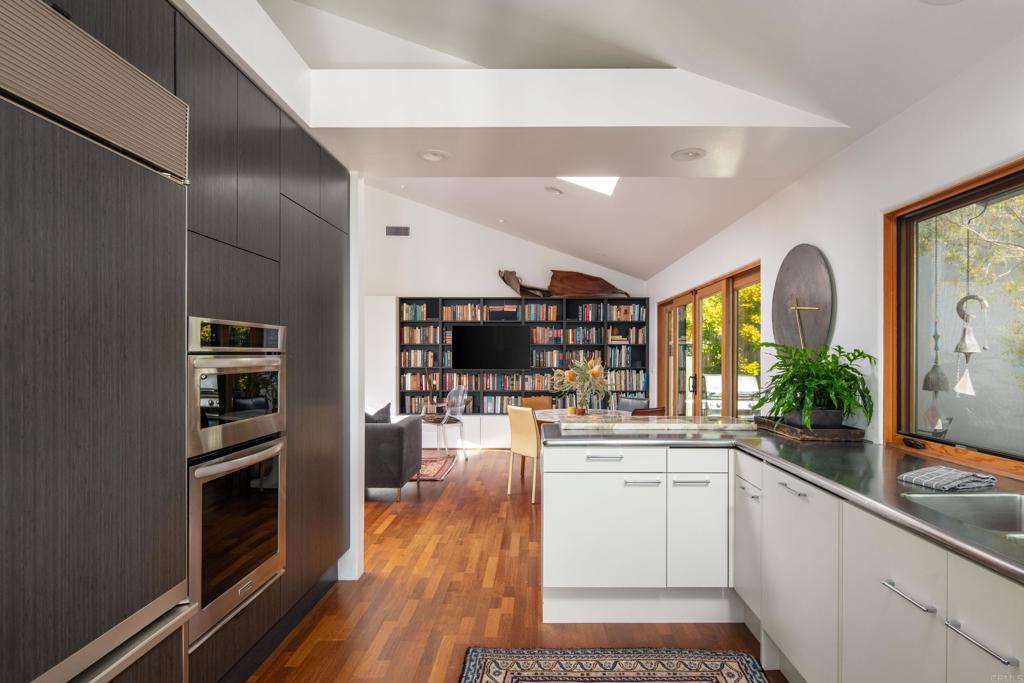 14014 Rue D Antibes Del Mar, CA 92014 - Photo 19 of 46 a kitchen with a sink stainless steel appliances and counter space