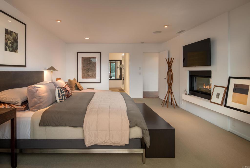 14014 Rue D Antibes Del Mar, CA 92014 - Photo 24 of 46 a bedroom with a bed and a flat screen tv