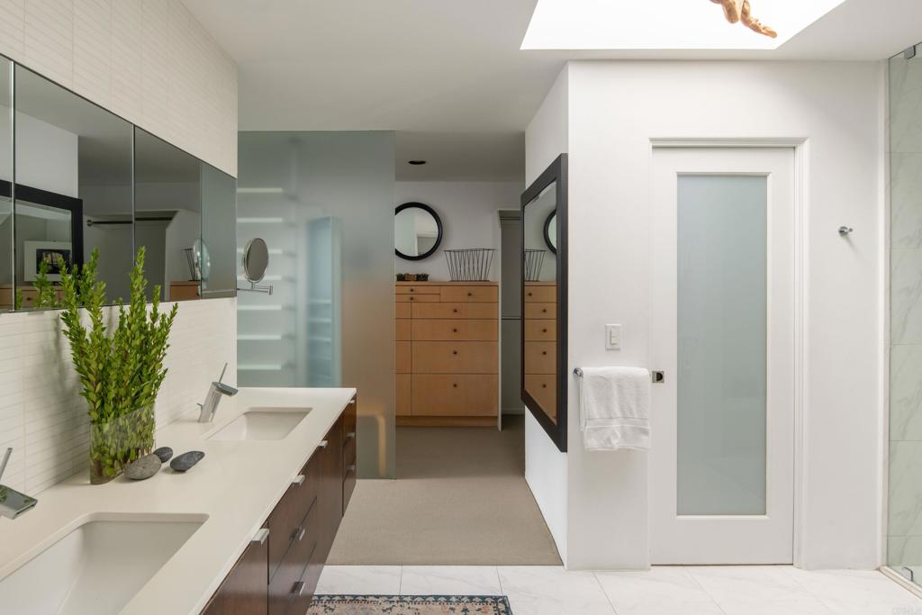 14014 Rue D Antibes Del Mar, CA 92014 - Photo 26 of 46 a spacious bathroom with a double vanity sink and a mirror