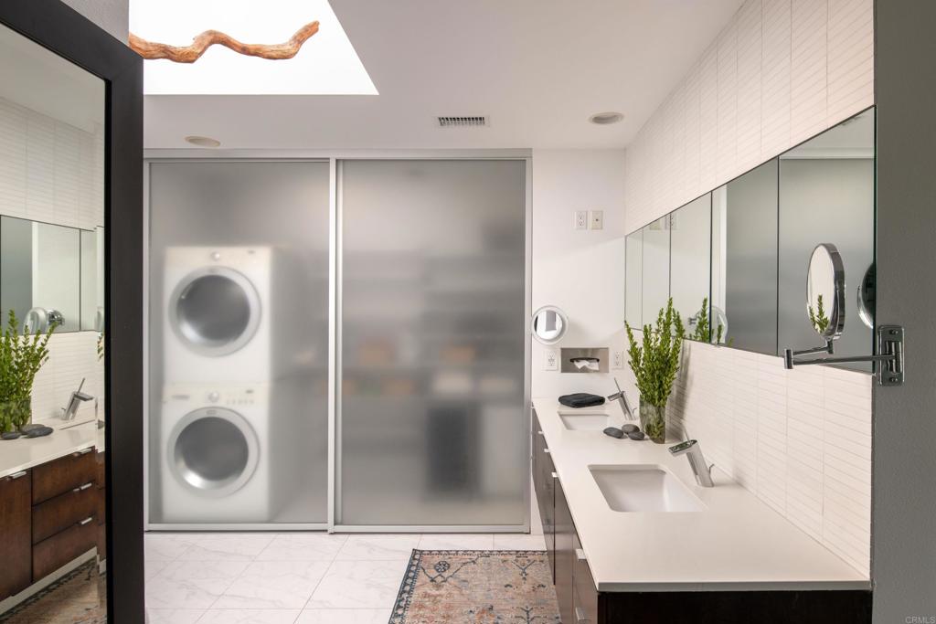 14014 Rue D Antibes Del Mar, CA 92014 - Photo 27 of 46 a bathroom with a sink a mirror and shower