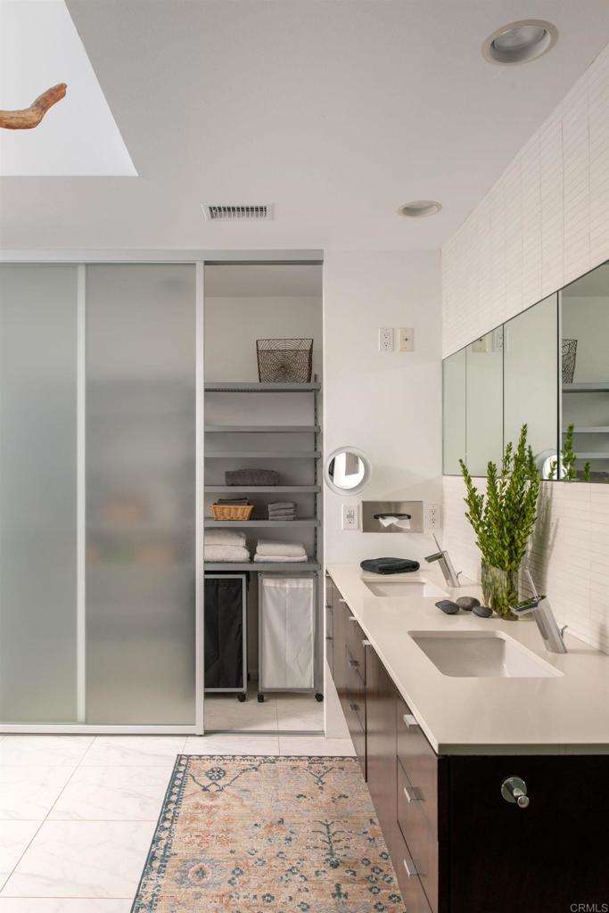 14014 Rue D Antibes Del Mar, CA 92014 - Photo 28 of 46 a kitchen with kitchen island stainless steel appliances a sink stove and cabinets