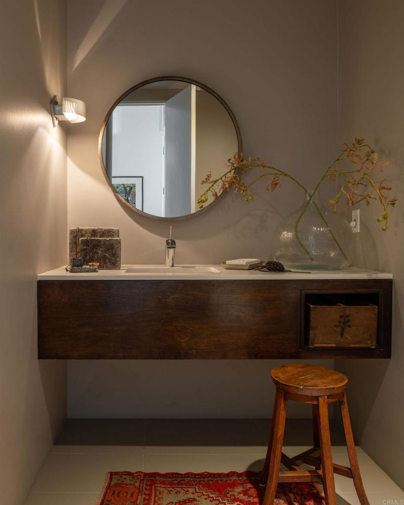 14014 Rue D Antibes Del Mar, CA 92014 - Photo 29 of 46 a bathroom with a sink a mirror and a toilet