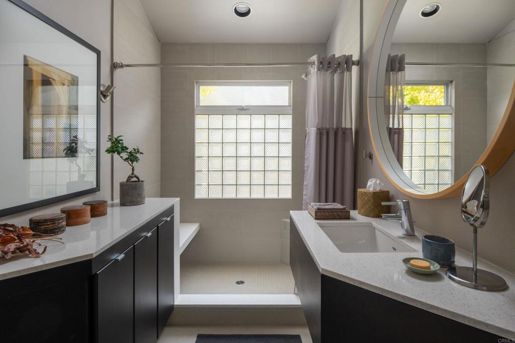 14014 Rue D Antibes Del Mar, CA 92014 - Photo 30 of 46 a bathroom with a sink and a mirror