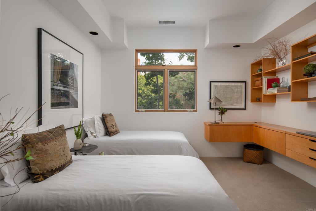 14014 Rue D Antibes Del Mar, CA 92014 - Photo 31 of 46 a bedroom with a bed couch and a window