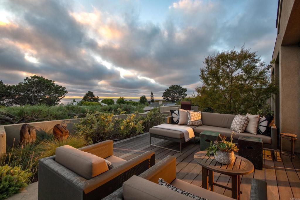 14014 Rue D Antibes Del Mar, CA 92014 - Photo 41 of 46 a view of a patio with couches fire pit and a yard