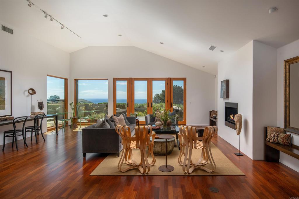 14014 Rue D Antibes Del Mar, CA 92014 - Photo 5 of 46 a view of a dining room with furniture window and wooden floor
