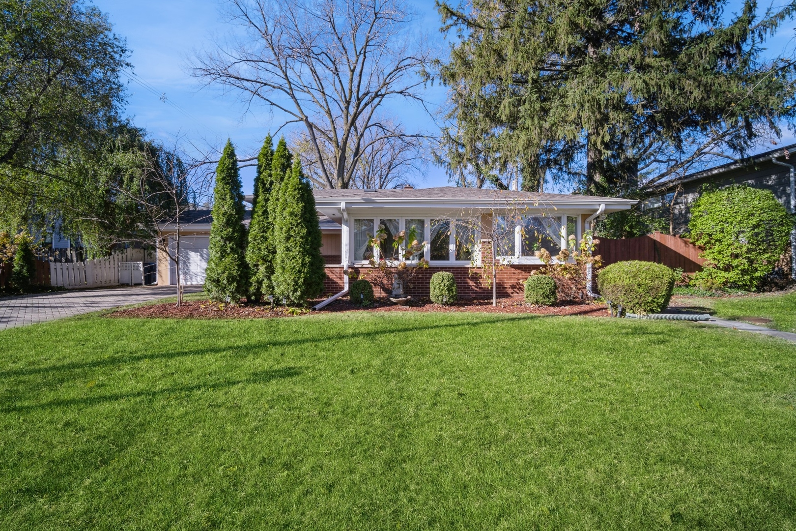 1450 Wescott Road Northbrook, IL 60062 - Photo 1 of 22 front view of a house with a yard