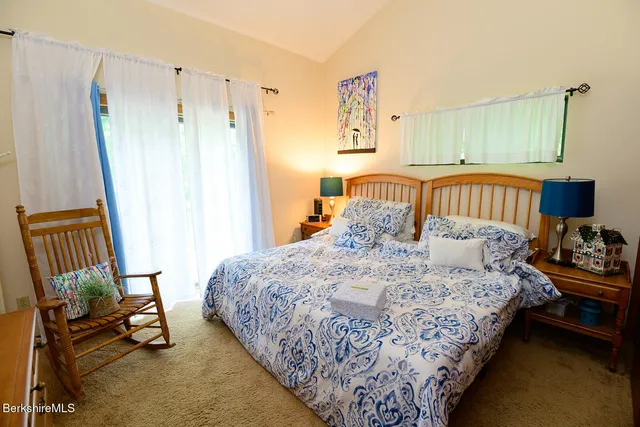 a bedroom with bed and a window