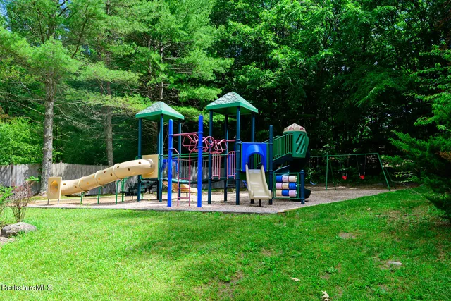 a view of a swimming pool with a yard