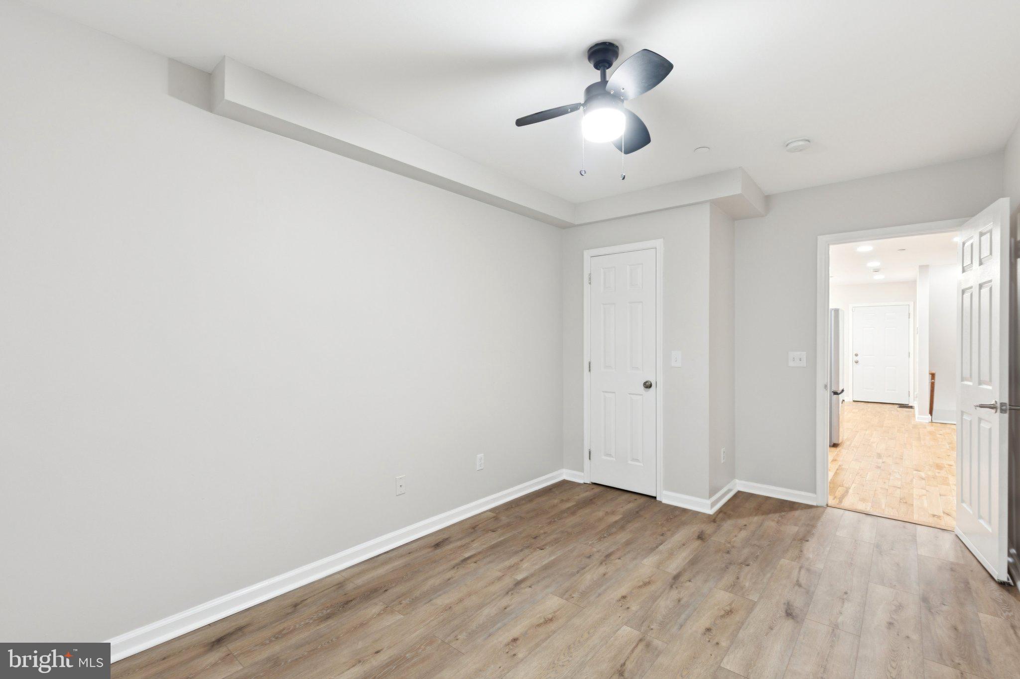 1931 North Uber Street, Unit 1 Philadelphia, PA 19121 - Photo 11 of 26 a view of empty room with wooden floor and ceiling fan