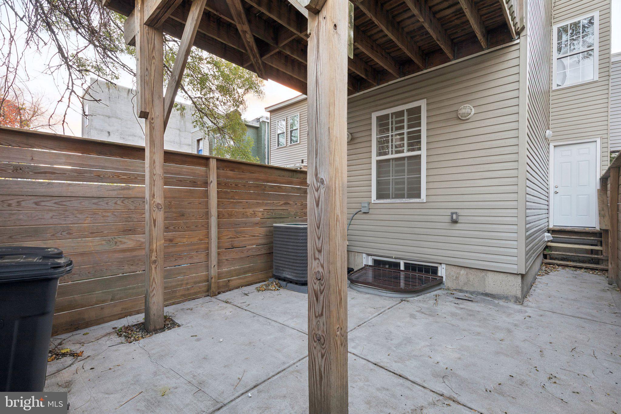 1931 North Uber Street, Unit 1 Philadelphia, PA 19121 - Photo 13 of 26 a view of a house with backyard and wooden fence