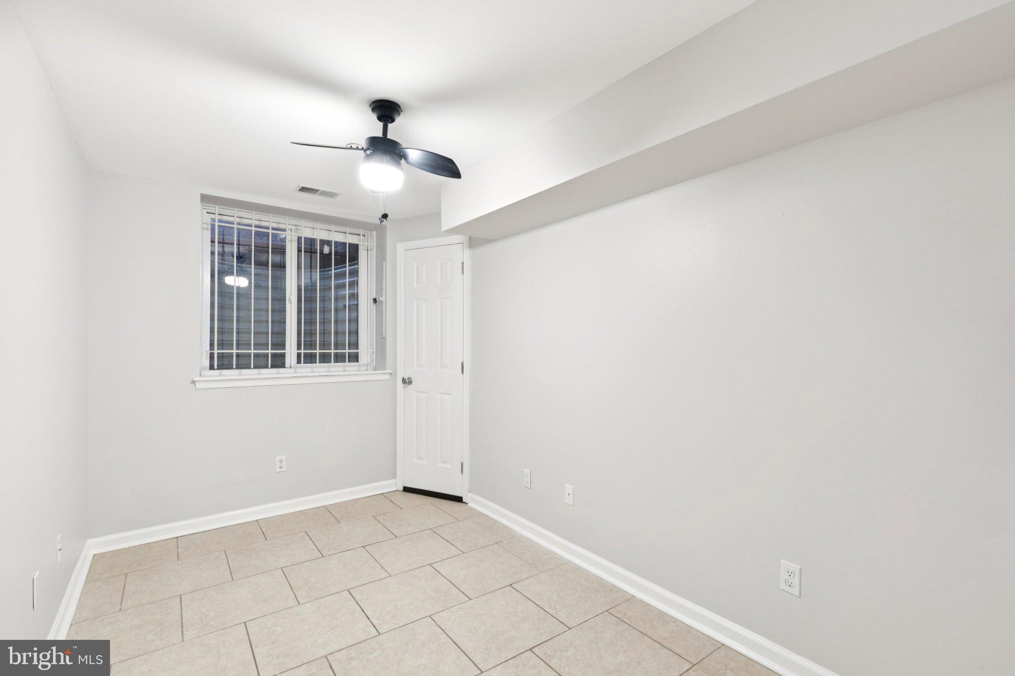 1931 North Uber Street, Unit 1 Philadelphia, PA 19121 - Photo 21 of 26 a view of an empty room with a window