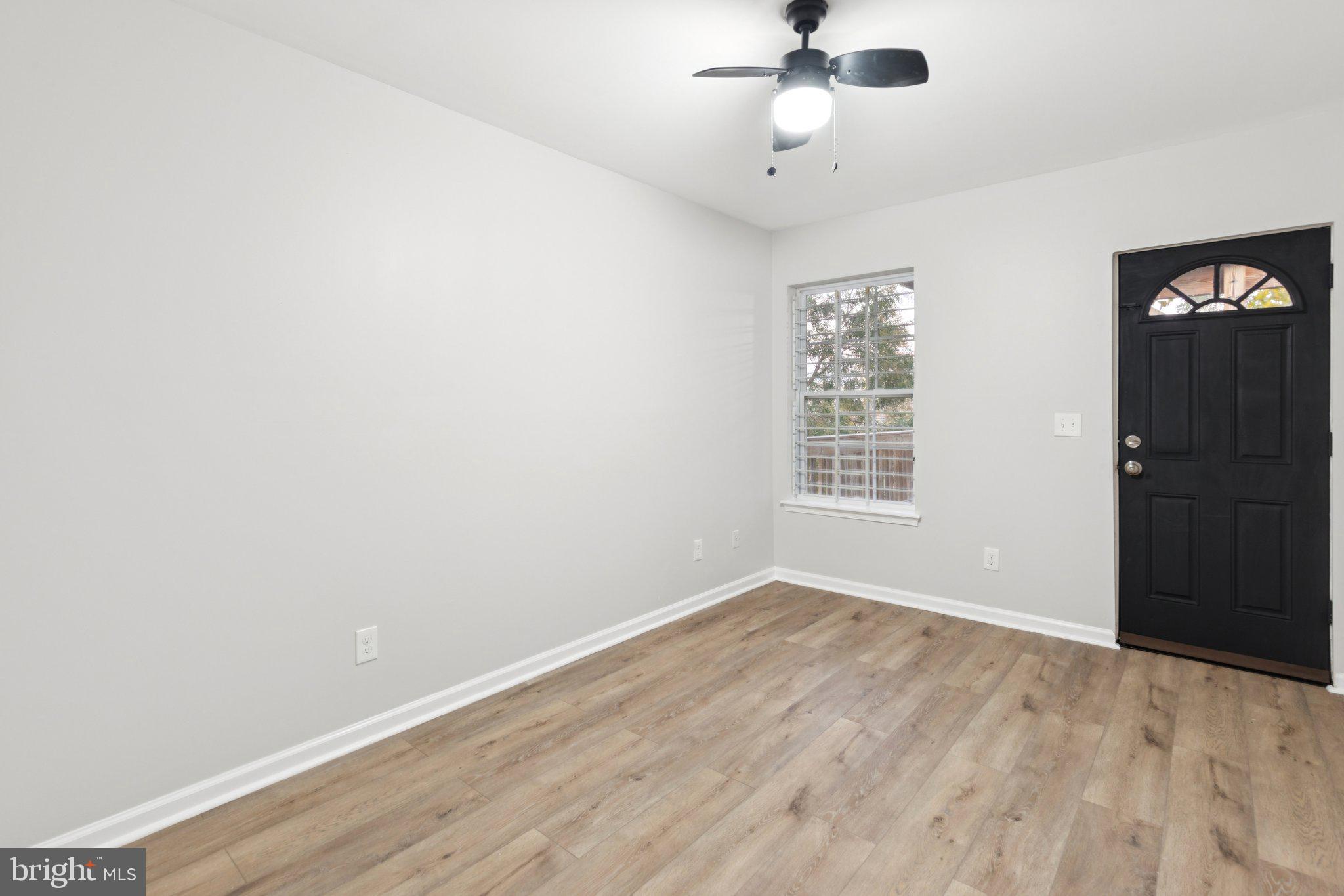 1931 North Uber Street, Unit 1 Philadelphia, PA 19121 - Photo 23 of 26 wooden floor in an empty room with a window