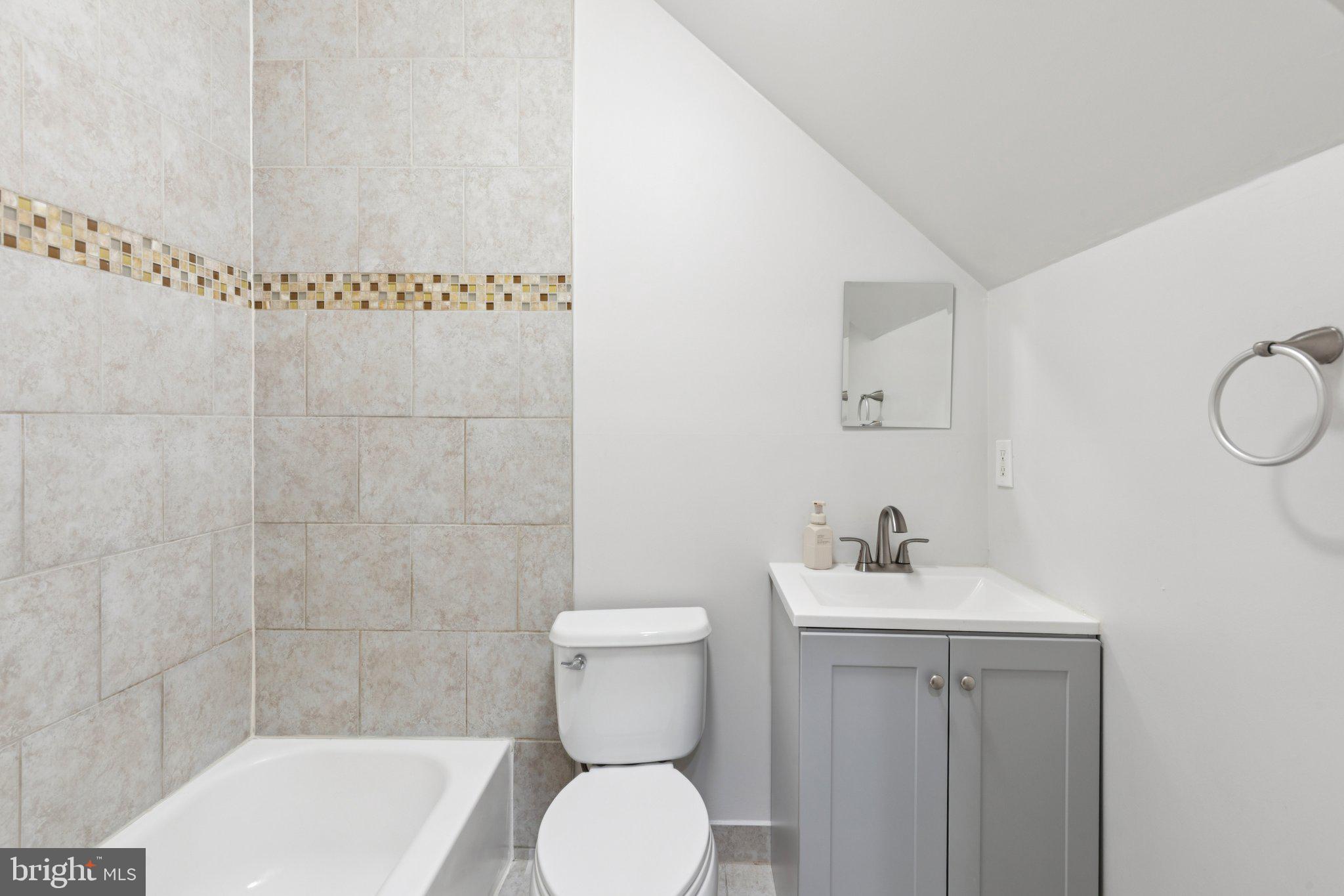 1931 North Uber Street, Unit 1 Philadelphia, PA 19121 - Photo 9 of 26 a bathroom with a toilet a sink and shower