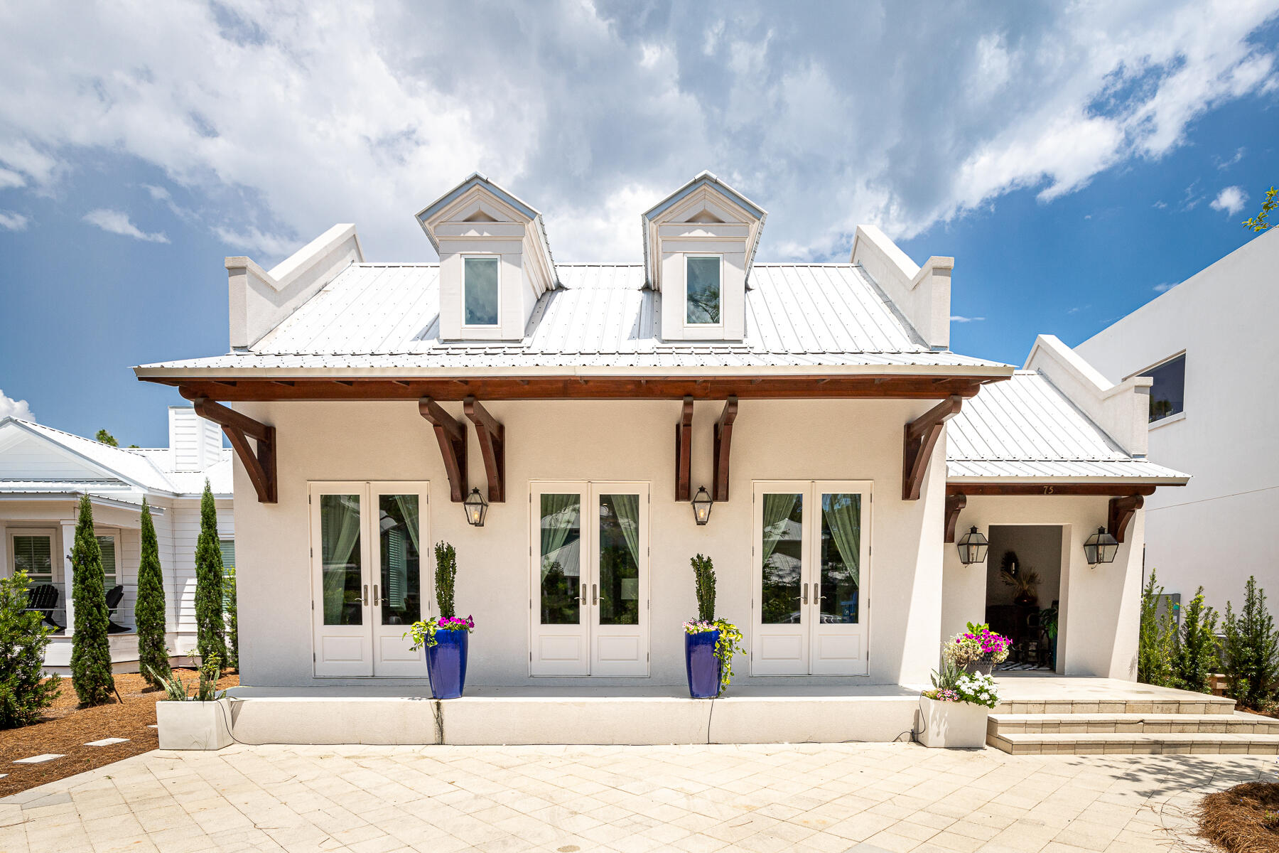 a view of a white house with outdoor space