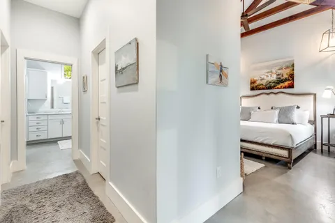 a bedroom with a bed and a view of bathroom
