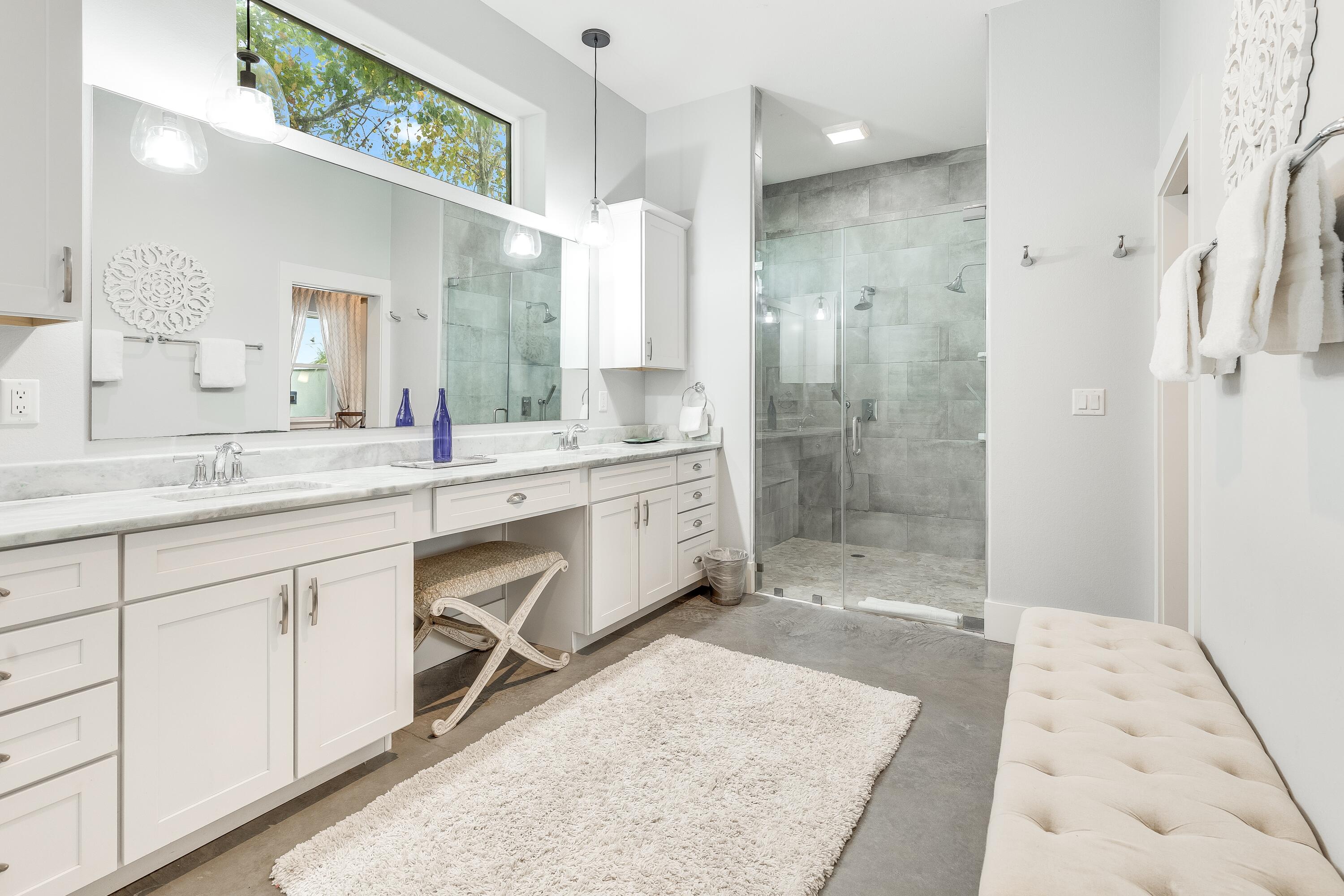 75 Barcelona Avenue Santa Rosa Beach, FL 32459 - Photo 17 of 41 a spacious bathroom with a shower sink and mirror