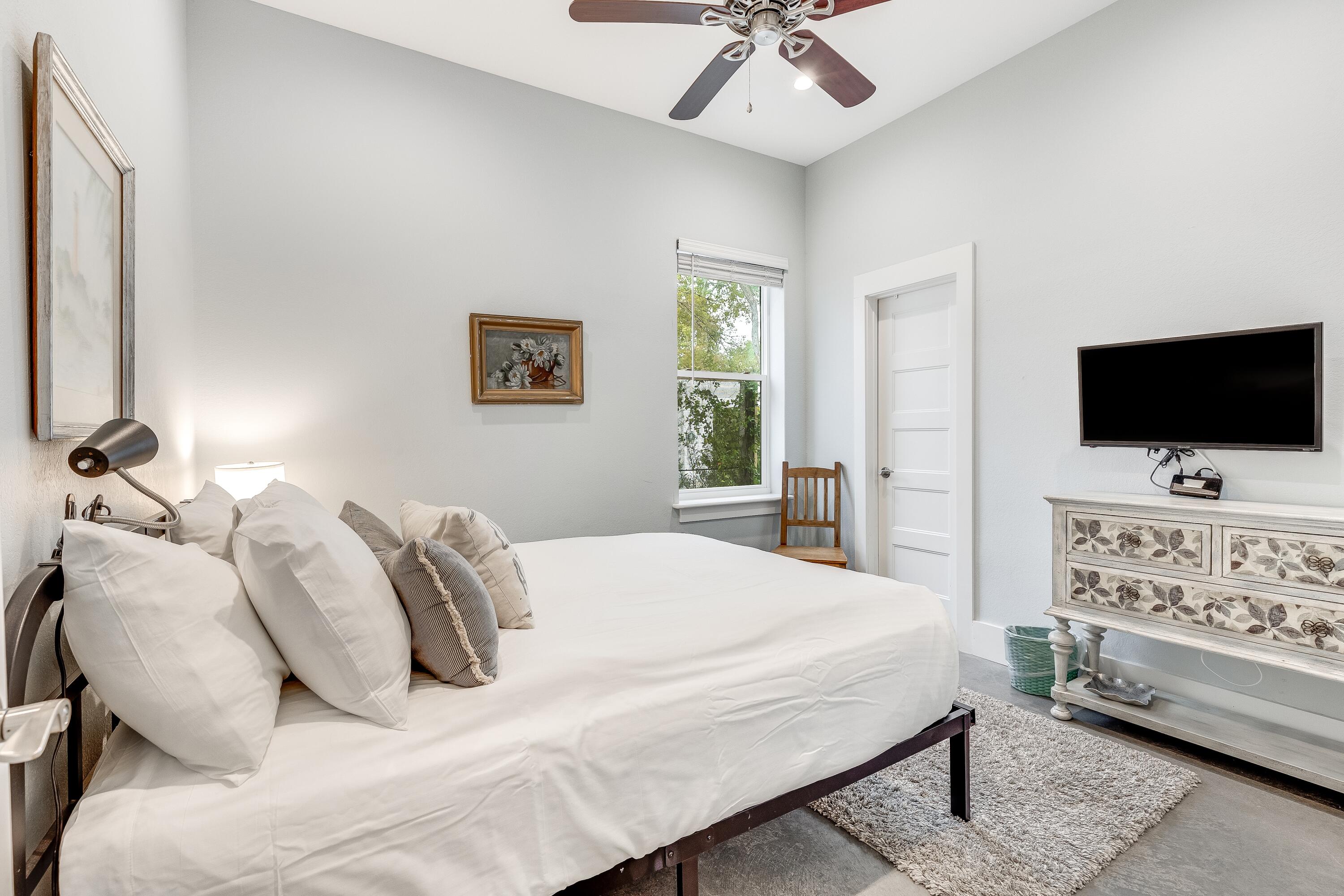 75 Barcelona Avenue Santa Rosa Beach, FL 32459 - Photo 19 of 41 a bedroom with a bed tv and couch