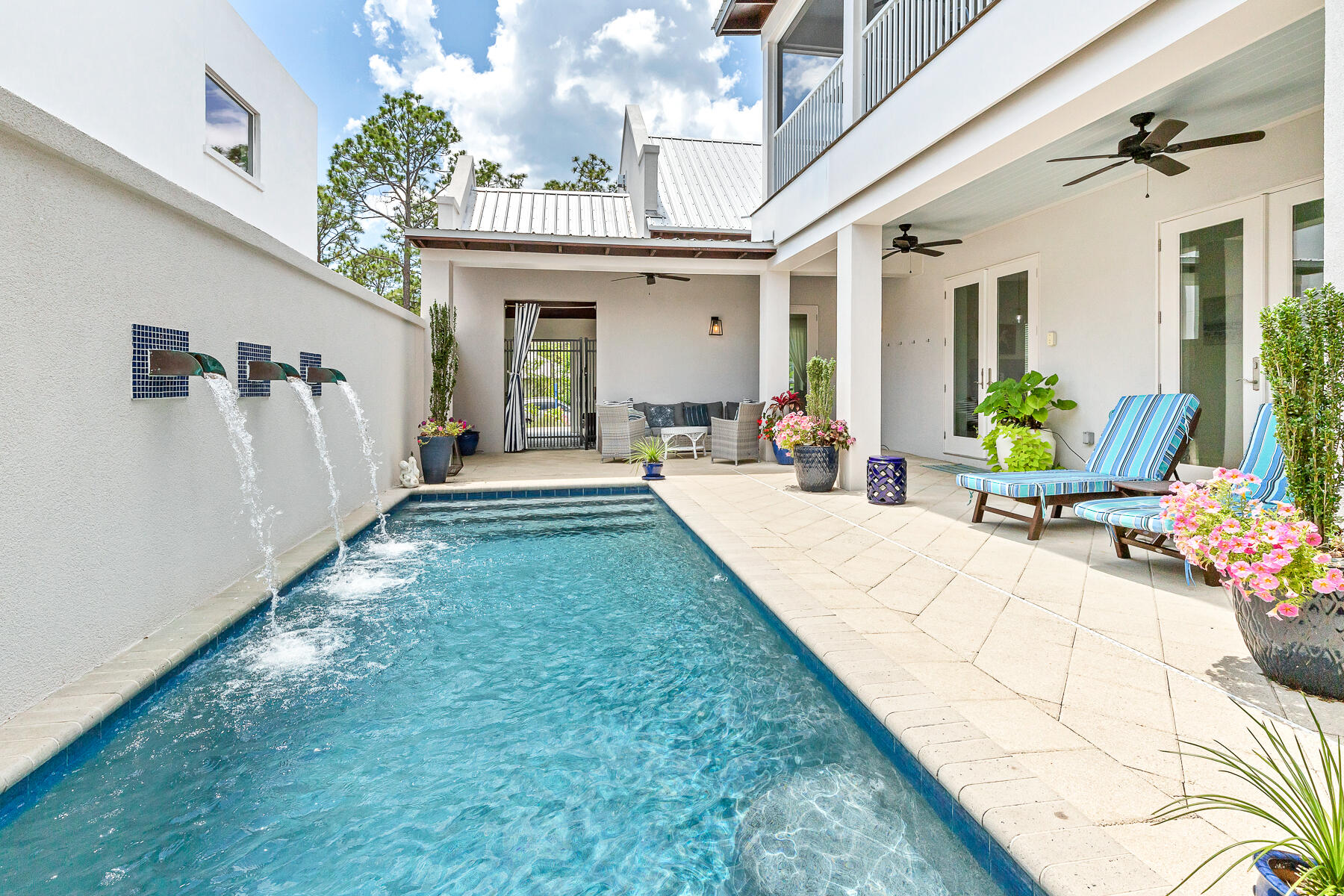 75 Barcelona Avenue Santa Rosa Beach, FL 32459 - Photo 2 of 41 a view of a house with backyard sitting area and garden