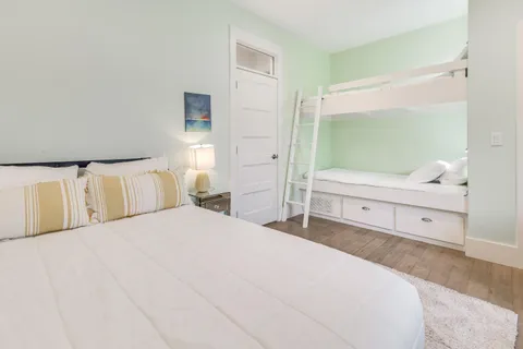 a bedroom with a large bed and a window