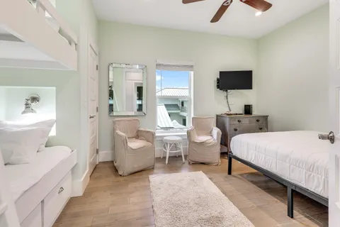 a spacious bedroom with a bed and glass wall