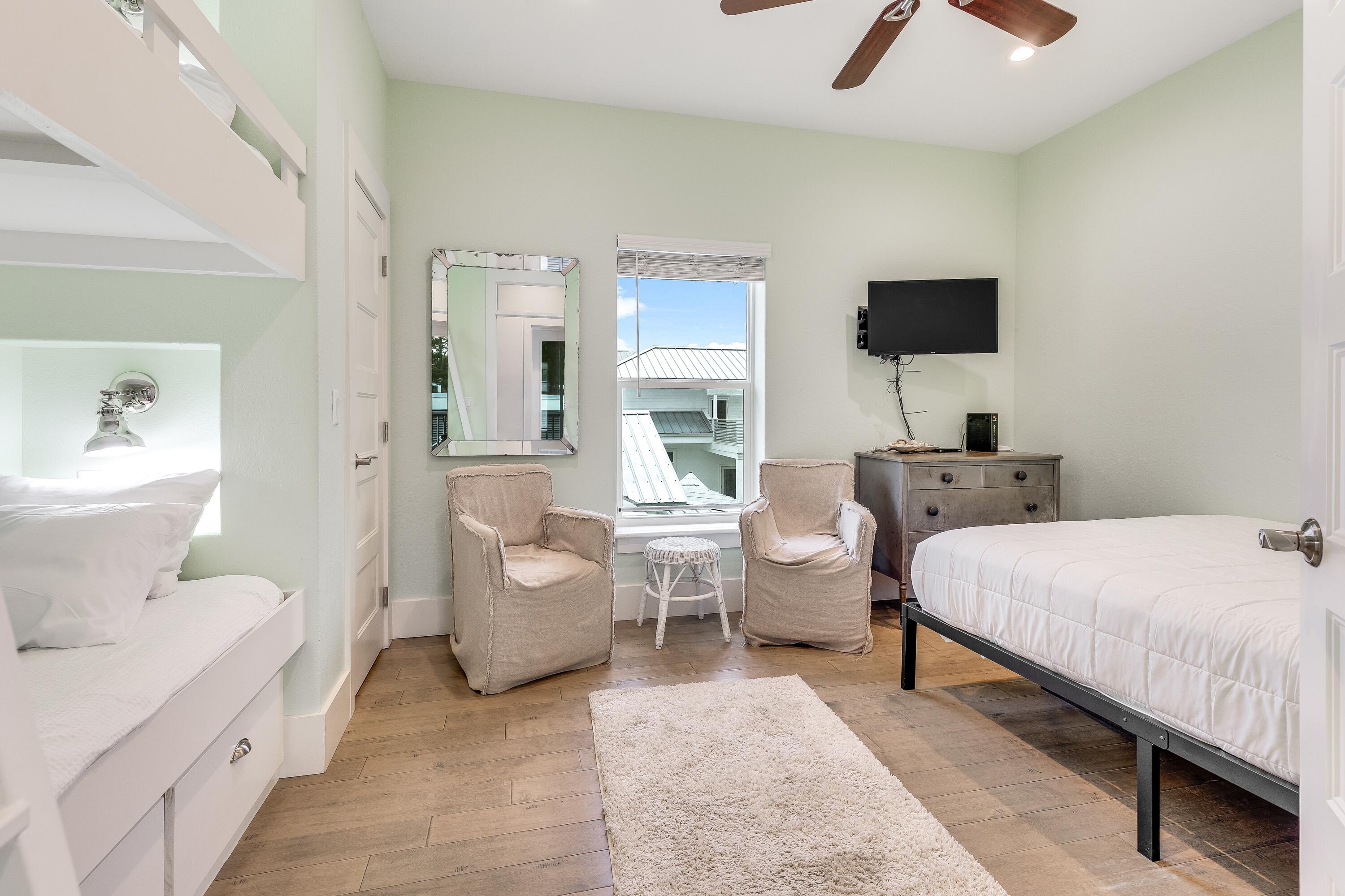 75 Barcelona Avenue Santa Rosa Beach, FL 32459 - Photo 26 of 41 a spacious bedroom with a bed and glass wall