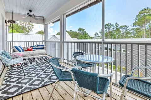 a balcony view with a seating space