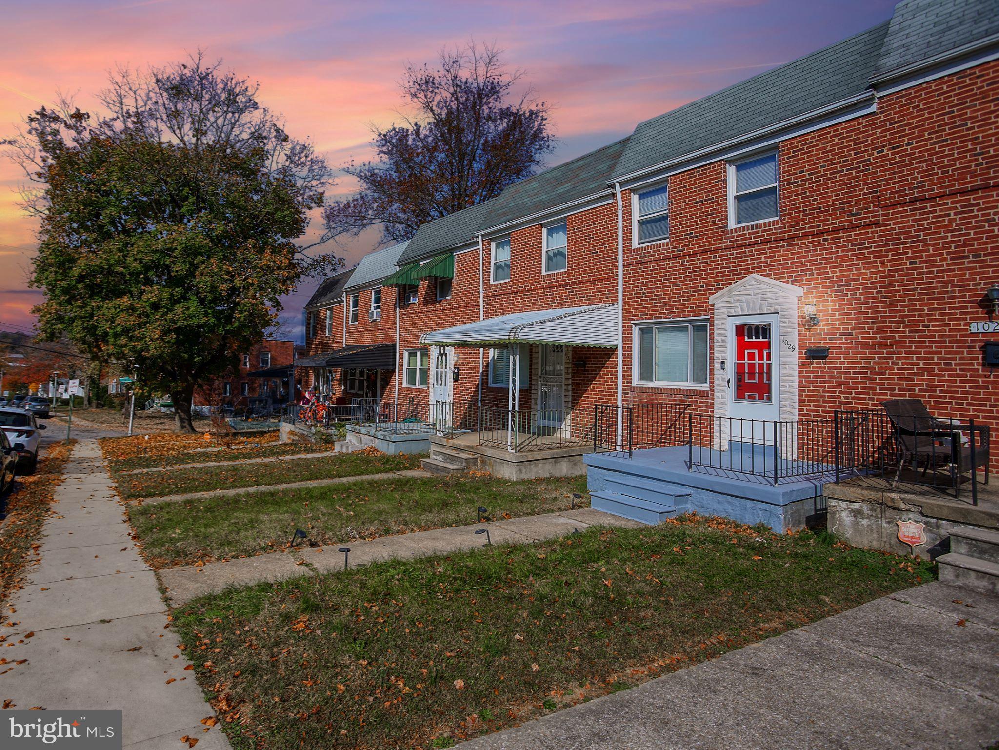 1029 Stamford Road Baltimore, MD 21229 - Photo 3 of 17 a front view of a house with a yard porch and outdoor seating