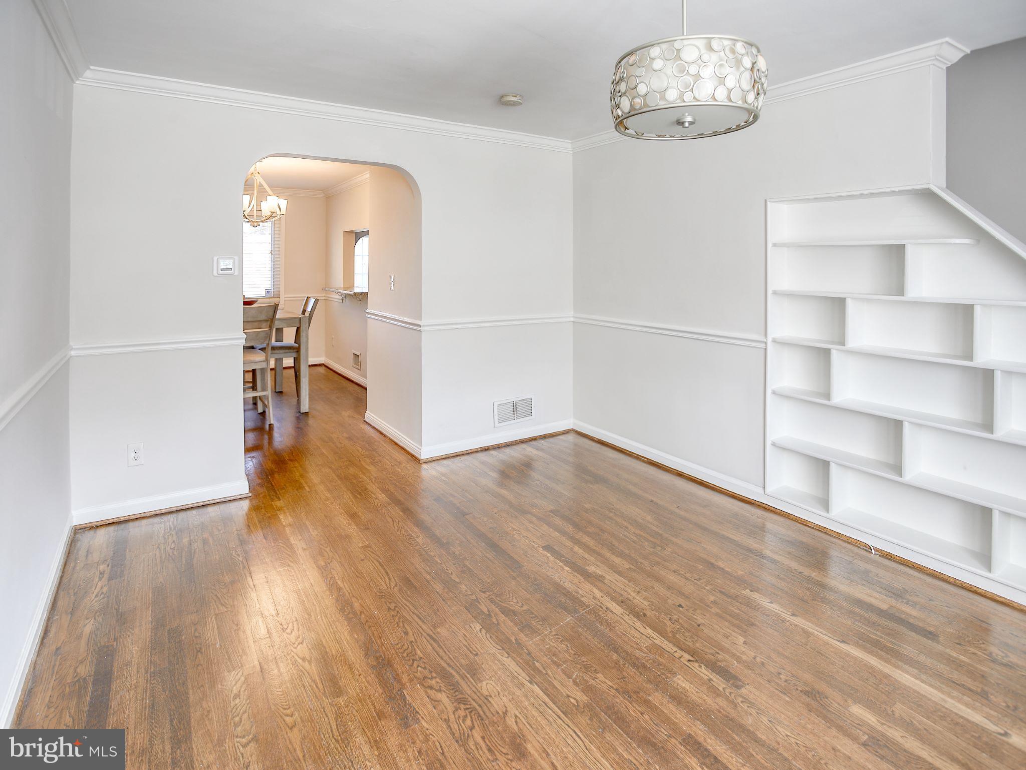 1029 Stamford Road Baltimore, MD 21229 - Photo 5 of 17 wooden floor in an empty room with a window