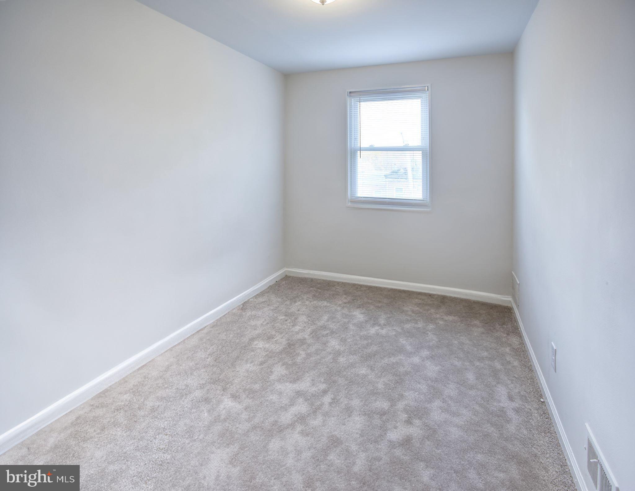 1029 Stamford Road Baltimore, MD 21229 - Photo 10 of 17 an empty room with a window