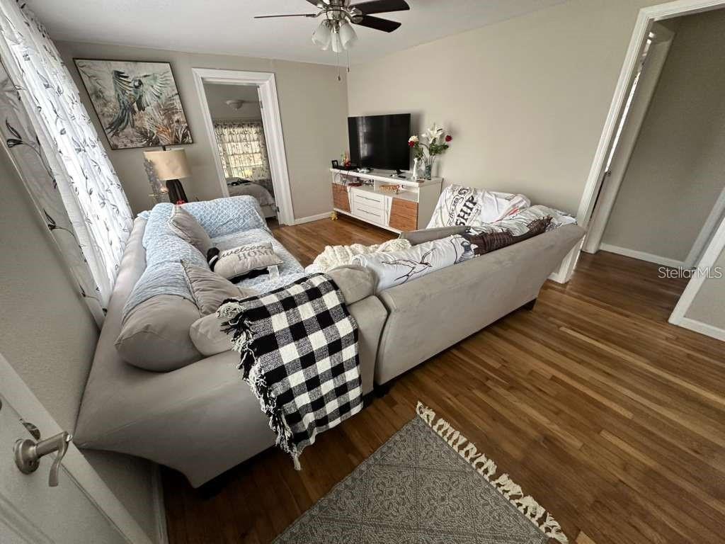 1509 Tate Street Cocoa, FL 32922 - Photo 6 of 12 a living room with furniture and a flat screen tv