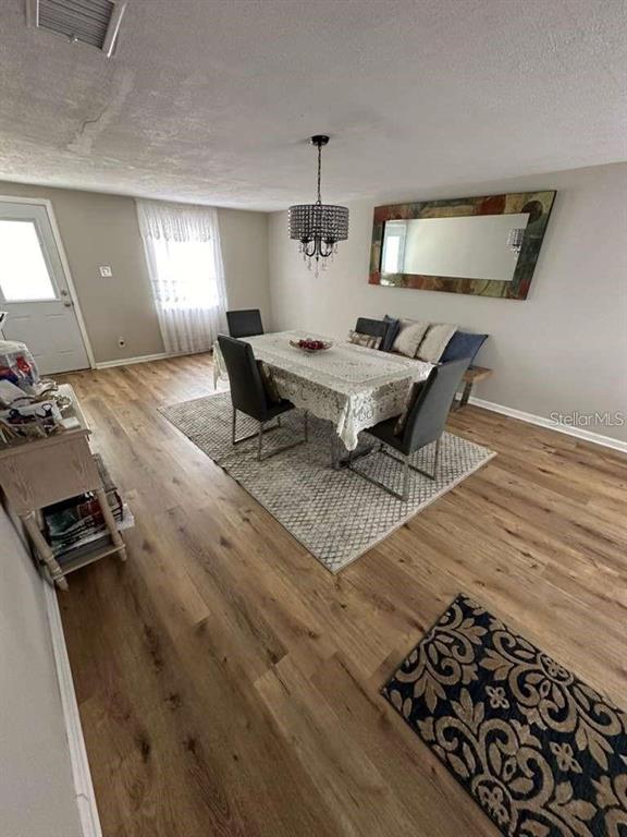 1509 Tate Street Cocoa, FL 32922 - Photo 8 of 12 a living room with a couch and a table