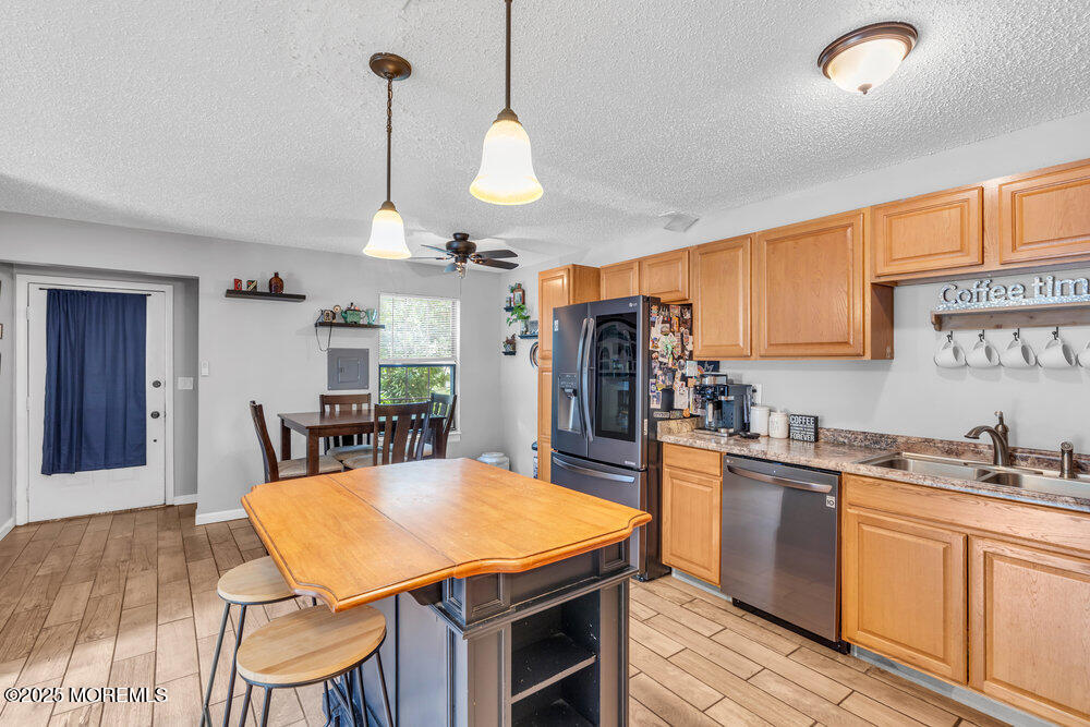 1506 Jasmine Court Jackson, NJ 08527 - Photo 20 of 20 a kitchen with stainless steel appliances granite countertop a sink a stove and refrigerator