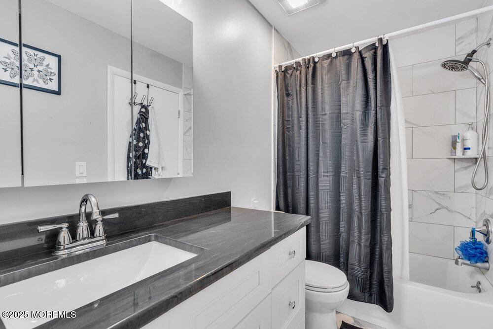 1506 Jasmine Court Jackson, NJ 08527 - Photo 13 of 20 a bathroom with a granite countertop sink toilet and shower