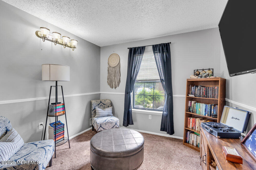 1506 Jasmine Court Jackson, NJ 08527 - Photo 15 of 20 a living room with furniture a window and a flat screen tv