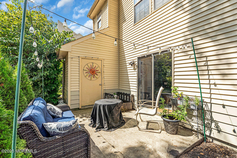 1506 Jasmine Court Jackson, NJ 08527 - Photo 16 of 20 a view of a patio with couches chairs and potted plants