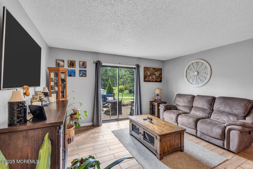 1506 Jasmine Court Jackson, NJ 08527 - Photo 3 of 20 a living room with furniture and a window