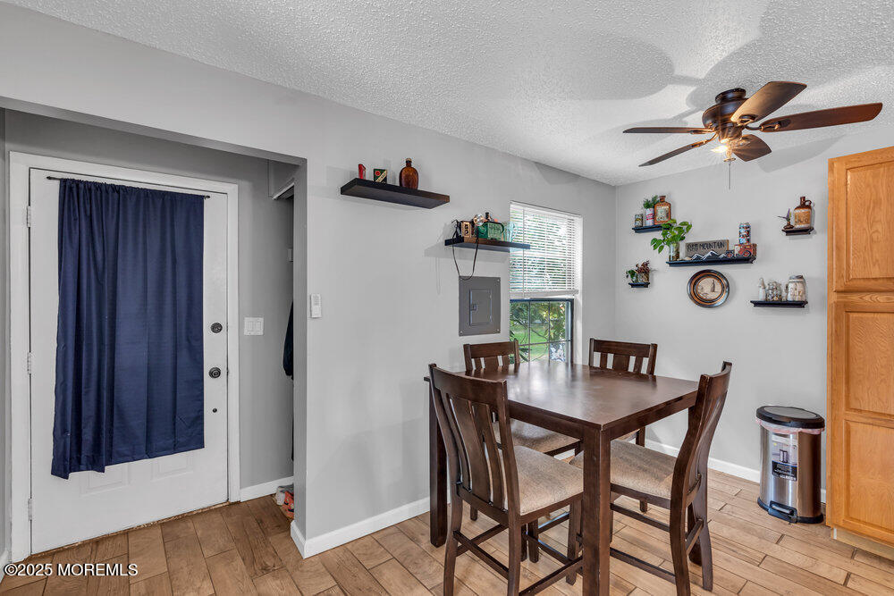 1506 Jasmine Court Jackson, NJ 08527 - Photo 9 of 20 a view of a dining room with furniture and wooden floor