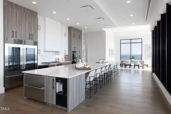 a kitchen with a stove and white cabinets