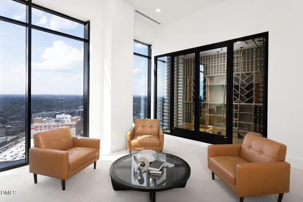 a view of a livingroom with furniture and a window