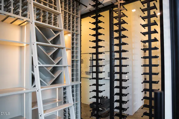 a living room with furniture a flat screen tv and a large window