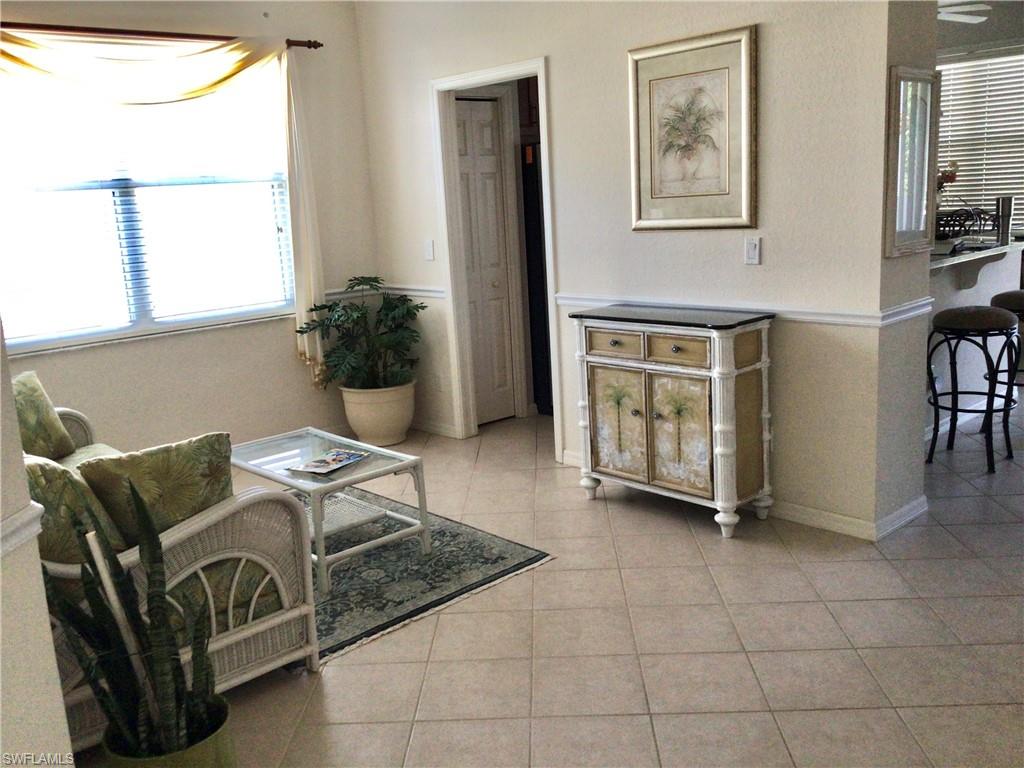 917 Fairhaven Court, Unit 29 Naples, FL 34104 - Photo 12 of 40 a living room with furniture and a window
