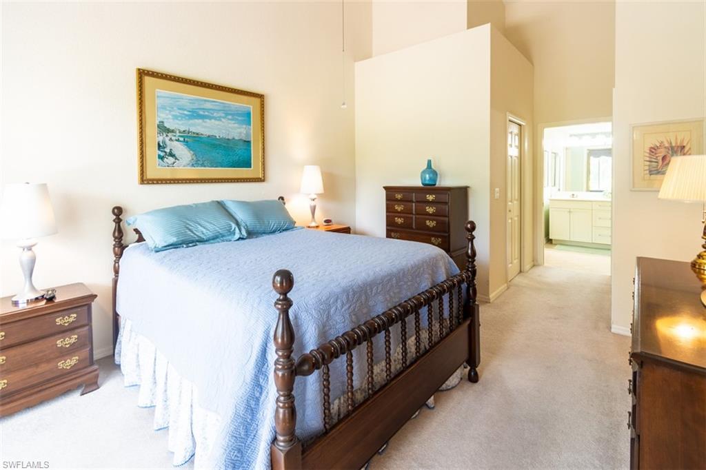 917 Fairhaven Court, Unit 29 Naples, FL 34104 - Photo 15 of 40 a bedroom with a bed next to a window with the outer view