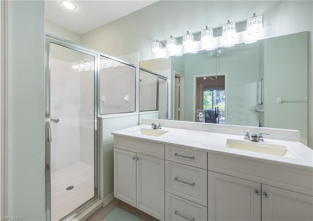 917 Fairhaven Court, Unit 29 Naples, FL 34104 - Photo 17 of 40 a bathroom with a double vanity sink mirror and double