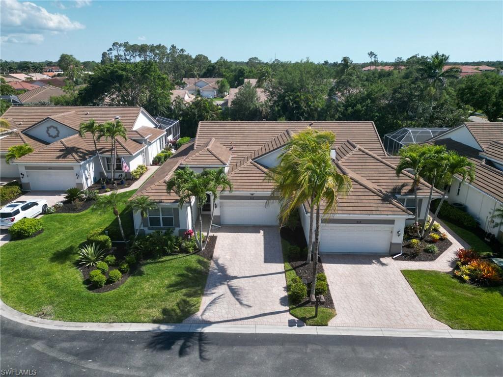 917 Fairhaven Court, Unit 29 Naples, FL 34104 - Photo 2 of 40 an aerial view of multiple houses